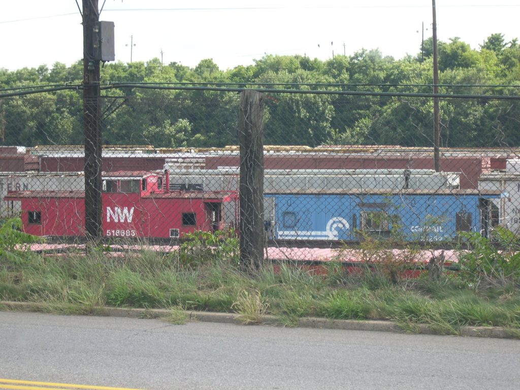 Norfolk Southern and a Conrail Caboose together